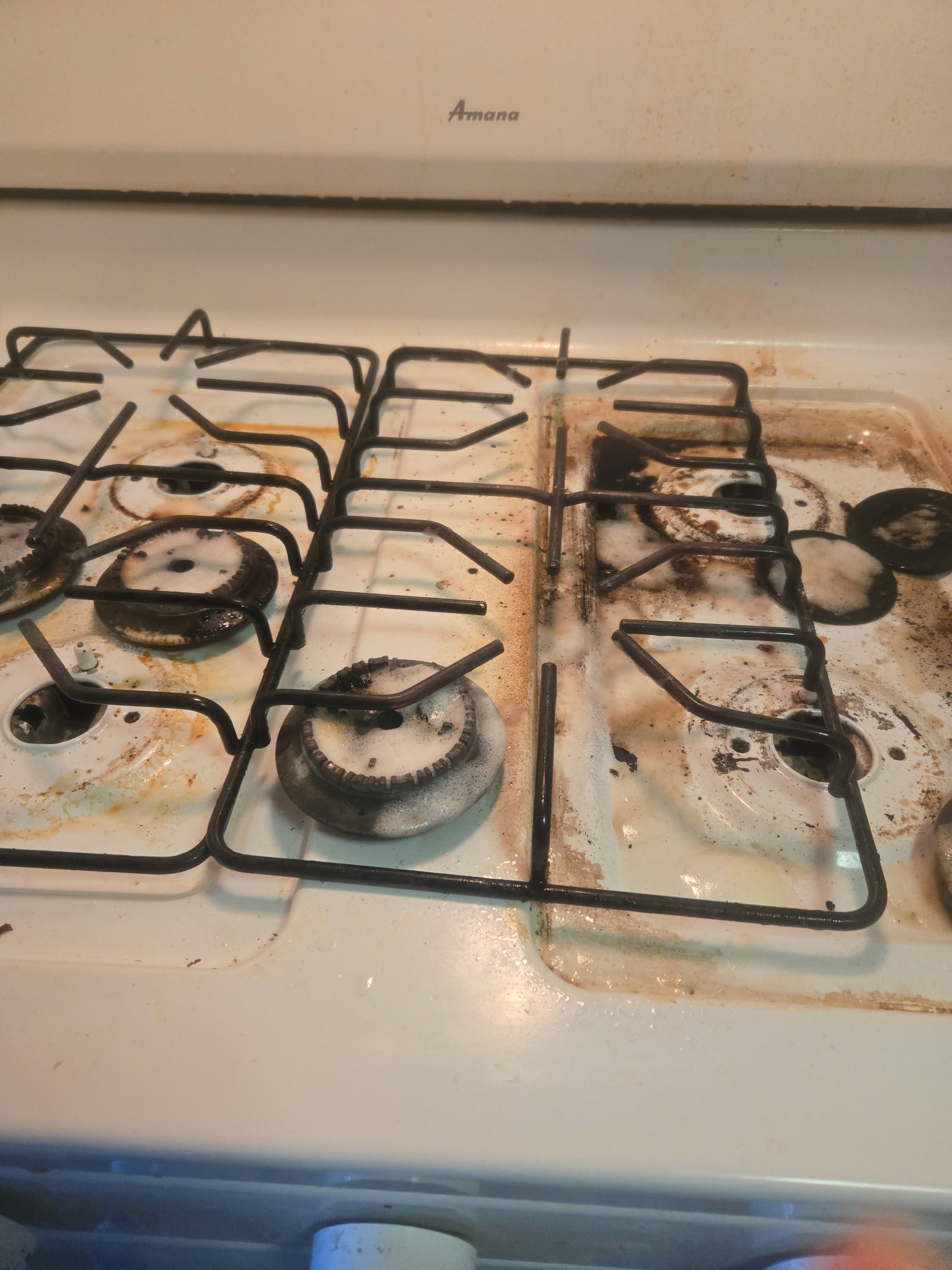 Stovetop before detailed kitchen cleaning